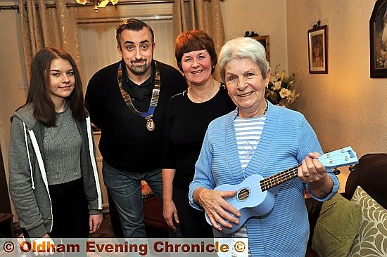 CHRISTMAS wish: Vilma Smith with her ukulele, granddaughter Emily Martin, daughter Corinne Ogden and Saddleworth Round Table chairman Matthew Sykes