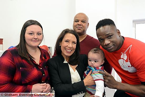 celebration: Oldham MP Debbie Abrahams (centre) meets Victor Daodu, his wife Robyn and their son Cyrus, with their friend Eric Noi (rear).