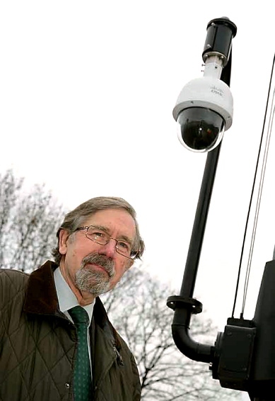 KEEPING watch . . . Councillor Andrew Fender with one of the new telescopic cameras