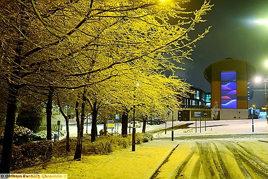 THE orange glow from street lights and trees heavy with snow made a magical scene in Oldham town centre this morning
