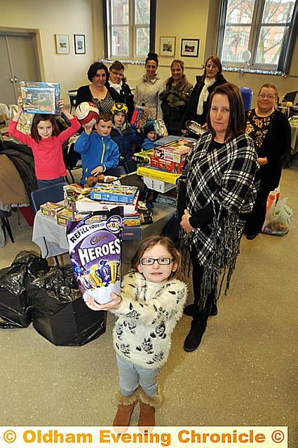 GENEROUS residents club together to donate items to the victims of a suspected arson attack. Pippa Baker (5) is pictured (front) with her mum and organiser Dallas Baker