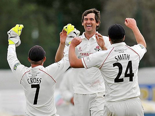 Kyle Hogg (centre) celebrates another wicket in his playing days
