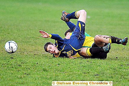 MR TUMBLE . . . Dynamos’ Josh Linney (Dynamos) is tackled from behind.