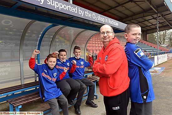 JACK can’t physically play football but he’s a great kit man . . . here he is pictured with Rochdale FC’s kit man Jack Northover and at the back are his school friends, from left, Will Taylor, Ben Goulding and Jacob Povey