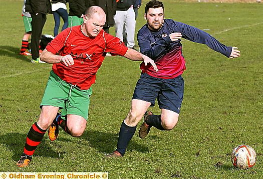 FULL POWER: Legends’ Andrew Fulham (left) tries to beat his man.