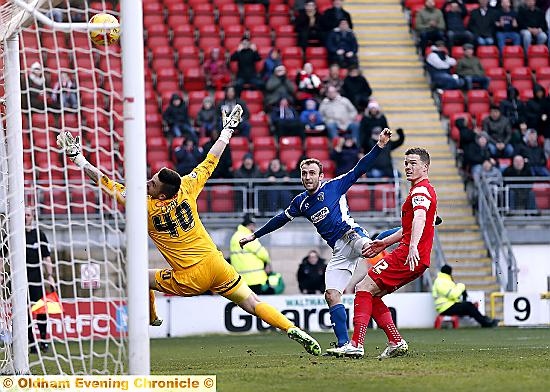 CHANCE WASTED: Liam Kelly smashes the ball against the crossbar after Jonathan Forte’s penalty was saved