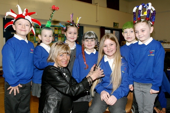 Ysabella Strudwick with hairdresser Sue Fink and some of her classmates