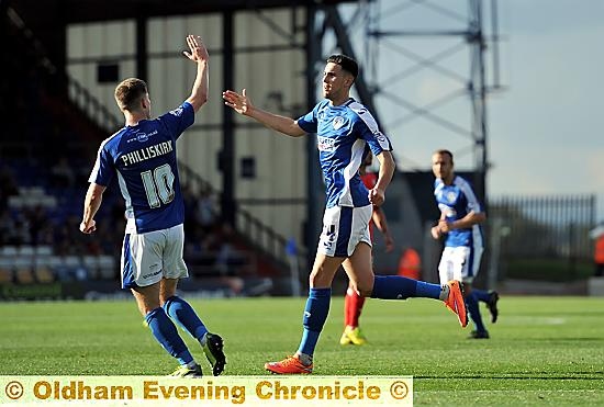 PUT IT THERE: Conor Wilkinson celebrates with Danny Philliskirk after scoring on his last appearance for Athletic against Walsall.