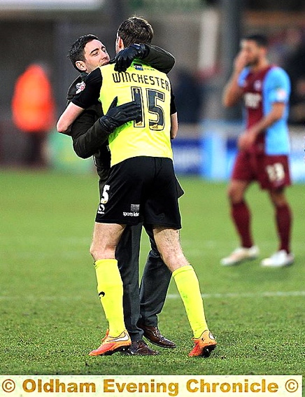 WELL DONE, SON . . . Lee Johnson congratulates goal scorer Carl Winchester.
LEE Johnson was left savouring his most satisfying win of the season thanks to Carl Winchester's solo strike.