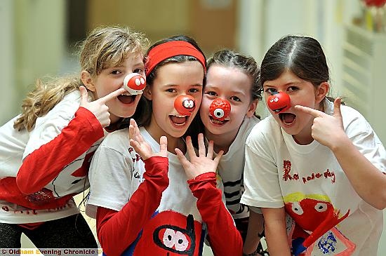 PUPILS at Greenfield Primary School got their Red Nose Day fund-raising down to a “T”. They designed their own Red Nose Day T-shirts, held a talent show, had a raffle and sold cakes, biscuits and photographs to raise money for Comic Relief. They also made picture frames for Mother’s Day. 
