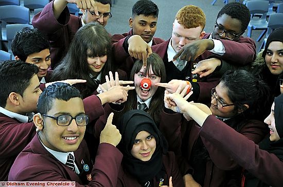 TOO many cooks didn’t spoil the Red Nose Day fun at Hathershaw College. Members of the student council baked and sold a staggering 600 cupcakes while other events included a football tournament and henna tattoos. The day raised around £650. Pictured centre is Jade Ross. 
