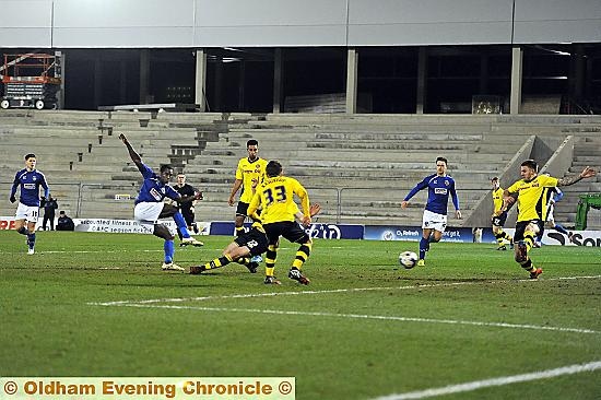 WHAT A CRACKER . . . . Jonathan Forte scores for Latics.