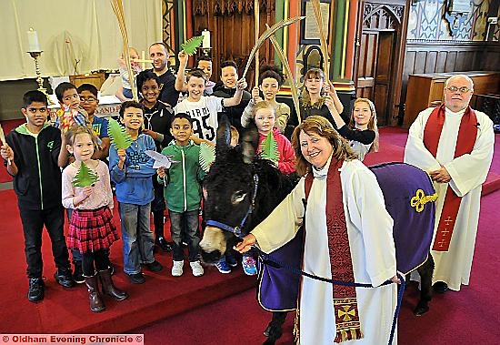 WALKABOUT: the Rev Jean Hurlston leads Bobby on a tour of the church watched by children in the congregation and vicar the Rev Derek Palmer