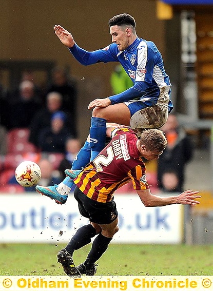 HIGH RISE . . . striker Conor Wilkinson takes to the air.
