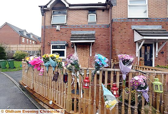 Flowers at the scene of last week's fire in Mossley.