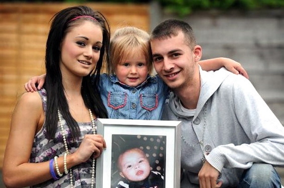 MEMORIES . . . Katie Corrie, Kaine Radcliffe and their daughter Leah-Chanel with a picture of baby Leo