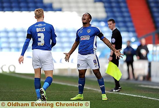 CENTRE STAGE: Dominic Poleon celebrates his first goal after a cool finish
