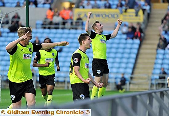 Danny Philliskirk (second, left) celebrates after putting Athletic ahead at the Ricoh Arena last night. 