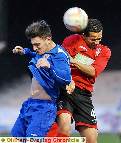 Saul Ashworth (left, Oldham Boro) and Ben Greenidge (Chadderton) tussle during the one-sided game
