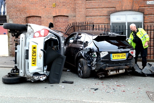 Police check the car wreckage at Chamber Mill, Chamber Road