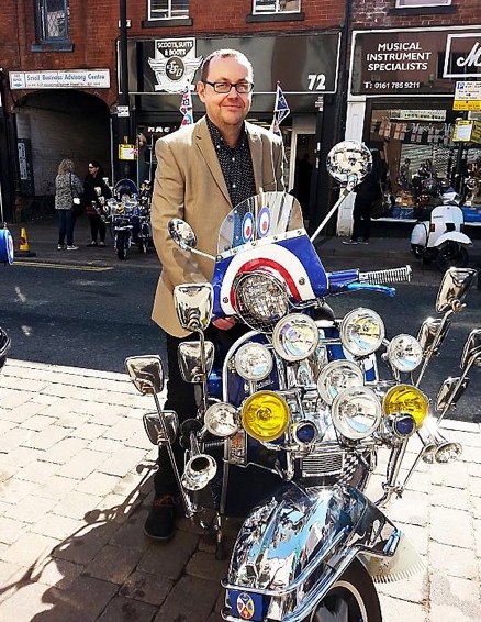 Owner Mick Harwood with classic scooter. 