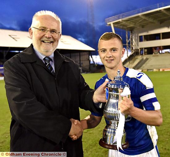 WELL-DESERVED: Andy Williamson, Football League chief operations officer, presents Athletic captain Jack Tuohy with the Youth Alliance Cup.