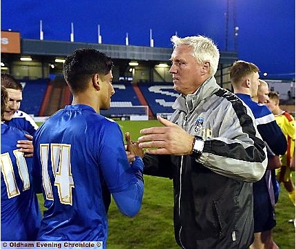 WELL DONE, SON: Academy manager Tony Philliskirk congratulates Athletic youngster Rahul Parmer.