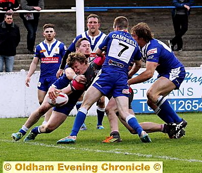 REACH OUT . . . Gareth Owen scores Oldham’s fourth and final try with three minutes to go.