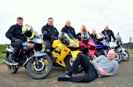 BIKER gang . . . (from left) Marc Ratcliffe, Scott Roberts, Lee Croston, Stephanie Ratcliffe, Ryan Bateson, Mick Croston and (lying down) his son Pete who will be riding a support vehicle