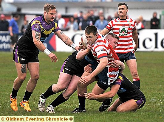 TAKE-DOWN: Outstanding Oldham man Phil Joy goes to ground during his side’s big win. 