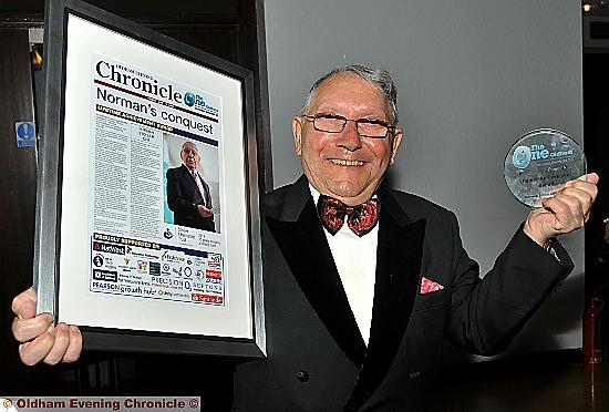 GLOWING with pride . . . Norman Stoller with his award
