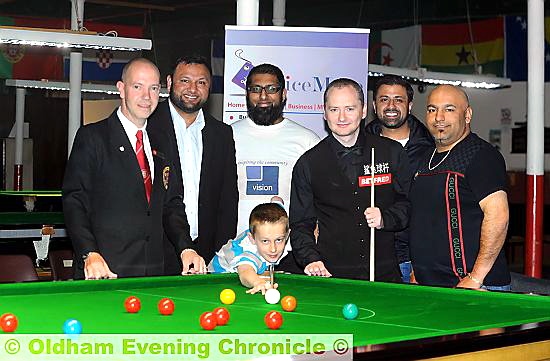 STAR OF THE FUTURE: Aaron Davies’s younger brother Ryan (front), who already has a 100 break to his name, played a frame with Graeme Dott last night at the Oldham Snooker Academy as the former world champion was in town to play an exhibition match.