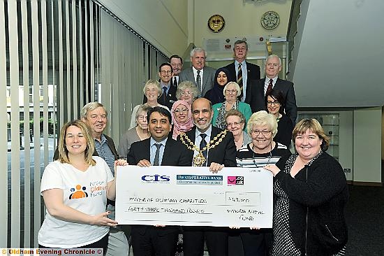 MAYOR Councillor Fida Hussain handed over £43,000 from his year in office to his four selected charities. The money was given to Mahdlo, The Christie, Action Oldham and Dr Kershaw’s in a presentation at the Civic Centre, one one of his last acts as mayor. Pictured with the Mayor are (l-r) Clare Taylor (Action Oldham), Kashif Ashraf (Mahdlo),Teresa Novotny (Dr Kershaw’s) and Julie Davies (radiographer at the Christie).