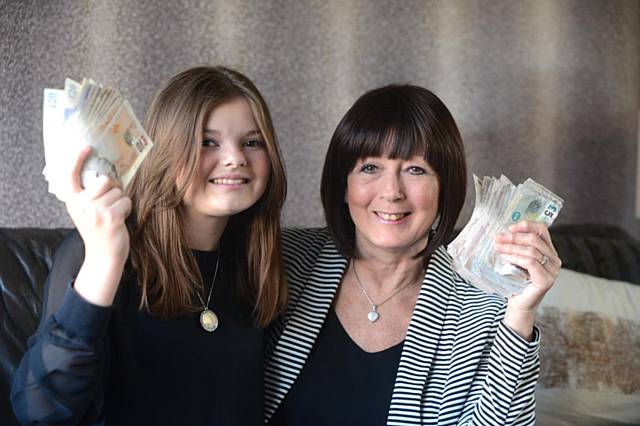 Grace Hulme (12) raised £2000 for Macmillan after organising a charity night at Royton Cricket Club, as her grandmother Janice Spinks suffers from multiple myeloma. 