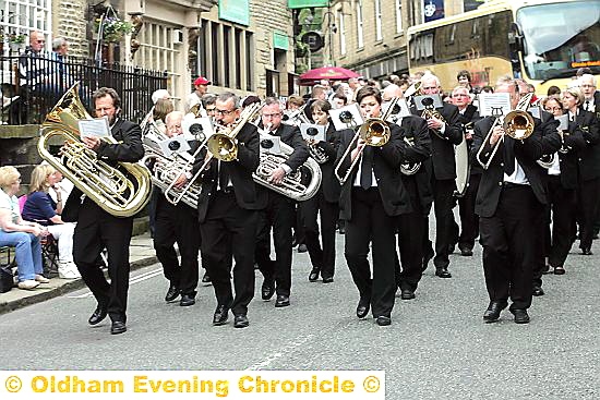 DIGGLE A band in action in Delph last year