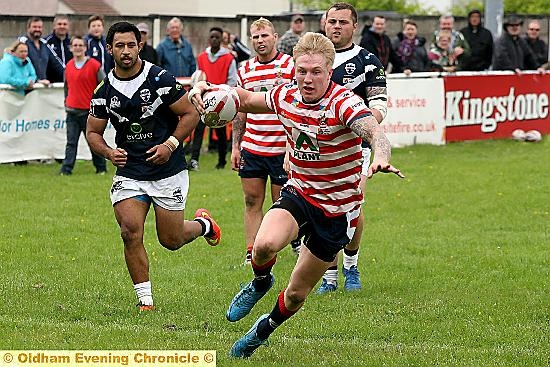 MARAUDER: Game star George Tyson hurtles forward in possession.