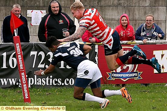 GEORGE ALMIGHTY . . . photographer Paul Sterritt captures the moment when Oldham centre George Tyson barged his way over the line