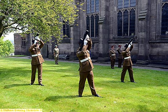 SOLDIERS fire in salute of their colleague outside Oldham Parish Church
