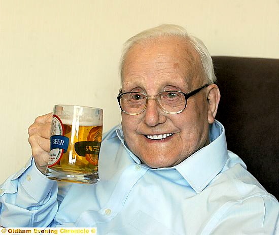 CHEERS: a glass of lager for John Warburton, who celebrated his 100th birthday yesterday