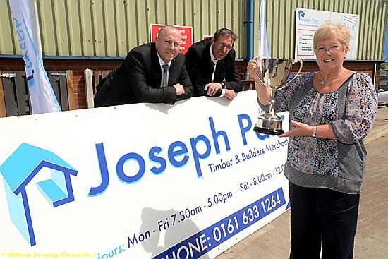 BIG SMILES: St Annes’ Barbara Henderson is pictured with (l-r): Liam Lee (sales and marketing director of sponsors Joseph Parr Ltd) and Geoff Cooke (Rugby Oldham Supporters' Trust chairman).