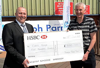 LIAM LEE with Rugby Oldham membership secretary Mike Kivlin, receiving Man of Steel Chris Hough’s £500 cheque.