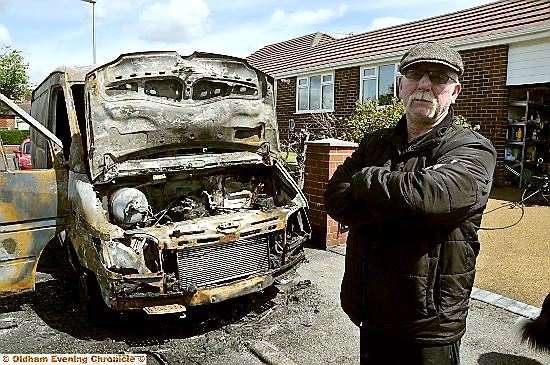 OWNER Michael Lowe, of Surrey Avenue, with his burned-out van