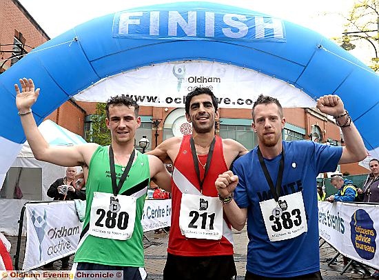 MILLTOWN 10k winner Bruno Lima (centre), Jacob Ragan (left), who finished second, and Rob Jones who was third