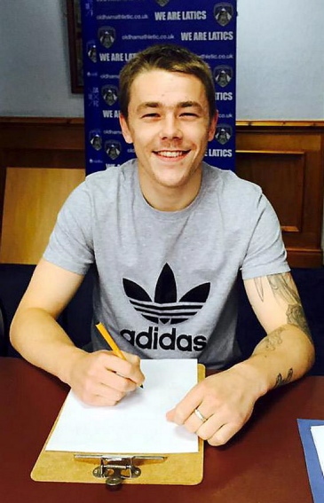 SIGN HERE . . . Athletic new George Green.