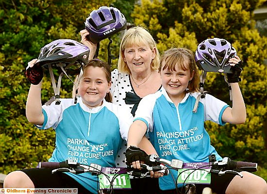 ON their bikes: Holly Taylor (left) and Katie Bissett with grandmother Maureen Oxley