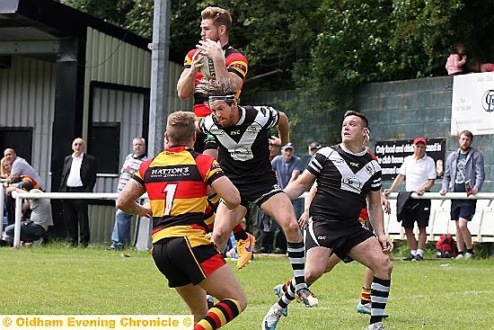 OUTJUMPED: Saddleworth’s Mitch Trothe is beaten to the ball.
