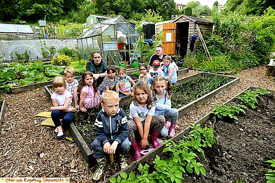 DEVASTATED . . . the Garden Gang from St Thomas’s School at the allotments. Teacher Karen Jakeman, back left, and parent Amirah Khan, back right, with children including, front from left, Jake Hacking, Frankie Birch and Heidi Verity. 