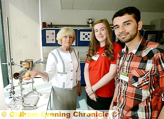 SCIENCE matters . . . Lady Ogden (Ogden Trust) is given a tour of the science lab by student Rebecca Thornley and former student Mukhtar Abdul Ghani