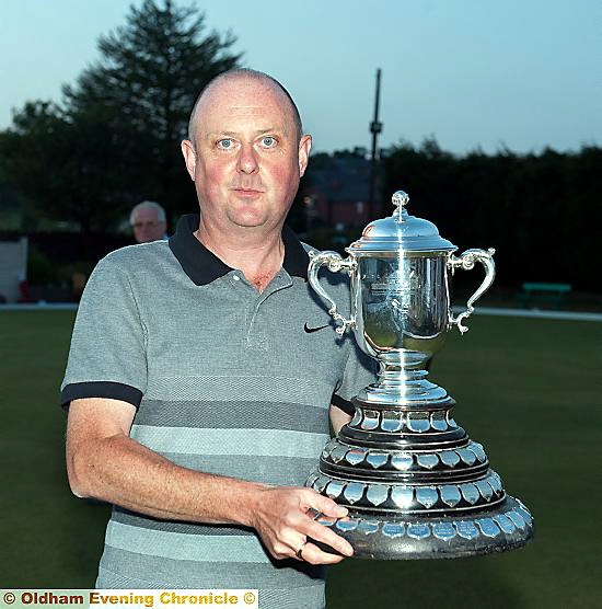 
WINNER . . . Darren Griffiths with the trophy in 2013