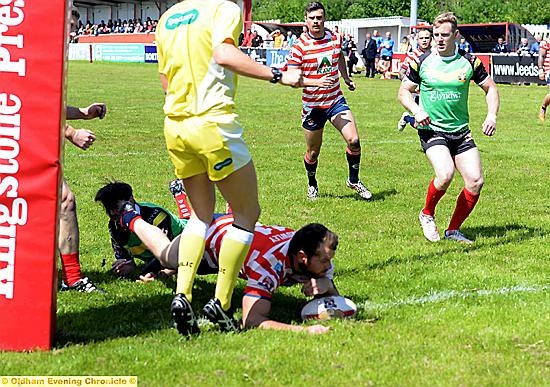 Josh Crowley scores Oldham's first try.